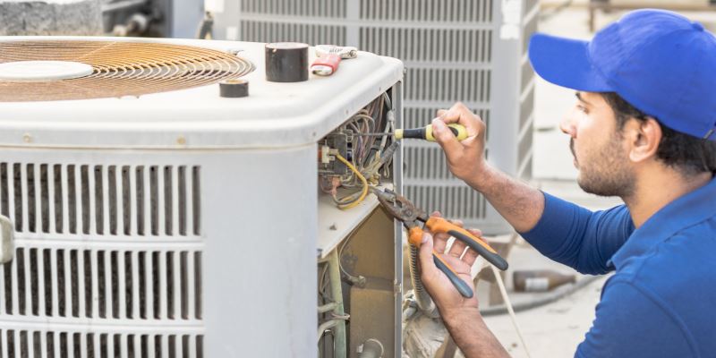 Man fixing an air conditioner